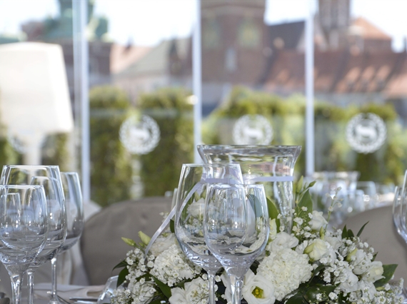 Glasses and flowers on table